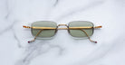 Jacques Marie Mage Dusk sunglasses with green lenses, top view.