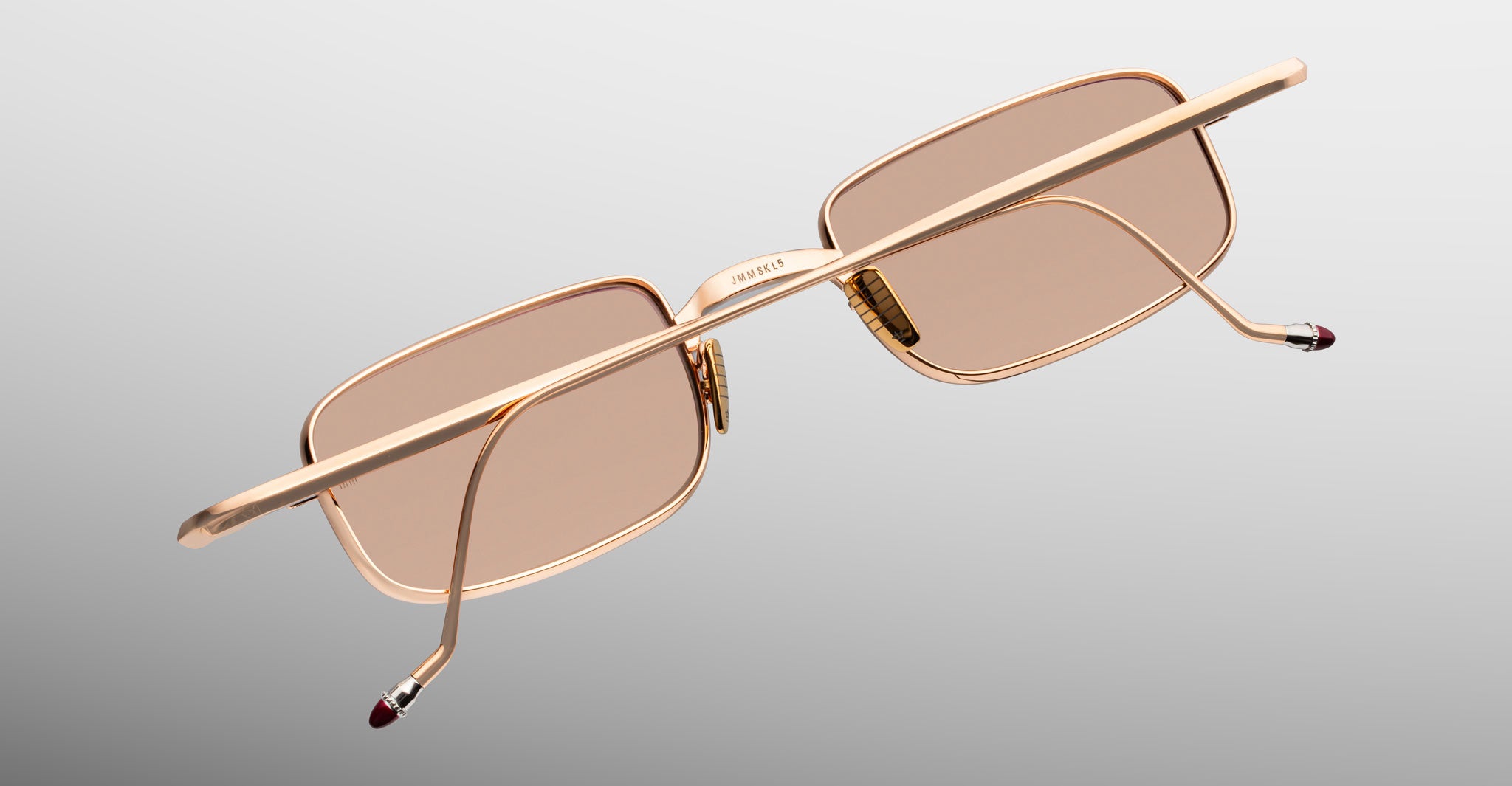 Jacques Marie Mage Dusk sunglasses with rectangular gold frames and brown lenses, back view.