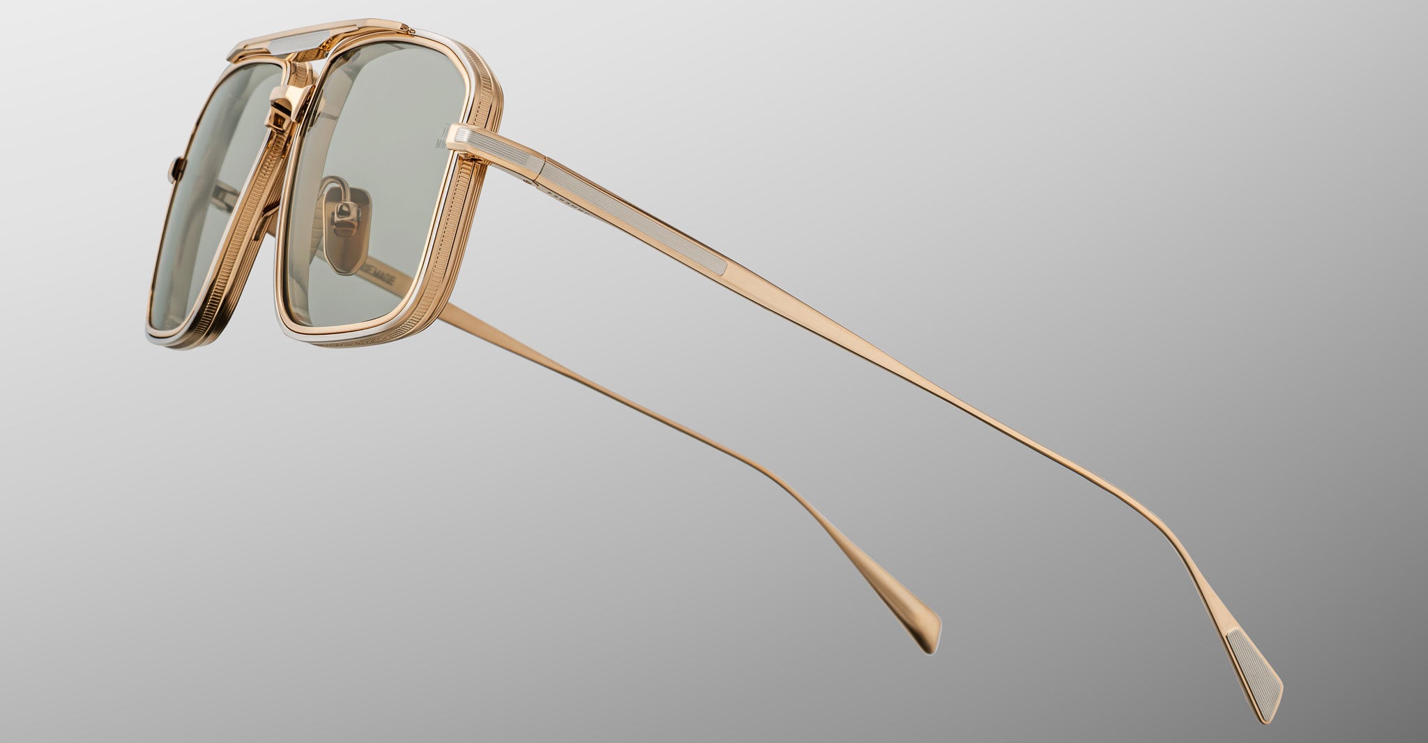 Jacques Marie Mage Earl rectangular sunglasses with gold frame and green polarized lenses, shown from the front.