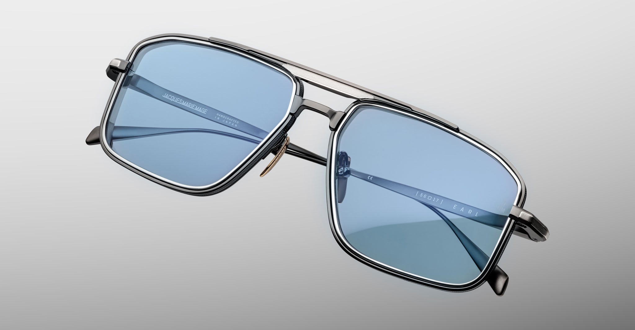 Jacques Marie Mage Earl sunglasses, rectangular metal frame with blue-tinted UV lenses, shown from the front angle.