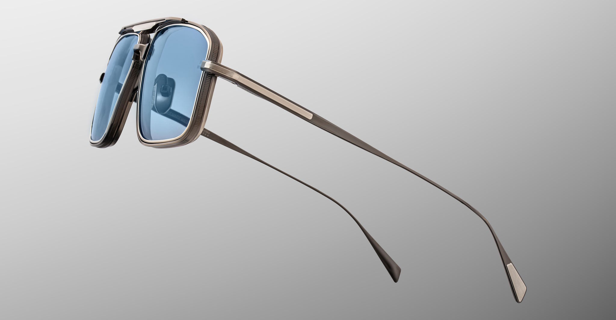 Jacques Marie Mage Earl sunglasses, front view, featuring blue-tinted square lenses, thin metal arms, and UV protection.