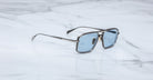 Jacques Marie Mage Earl aviator sunglasses with blue lenses, viewed from above.