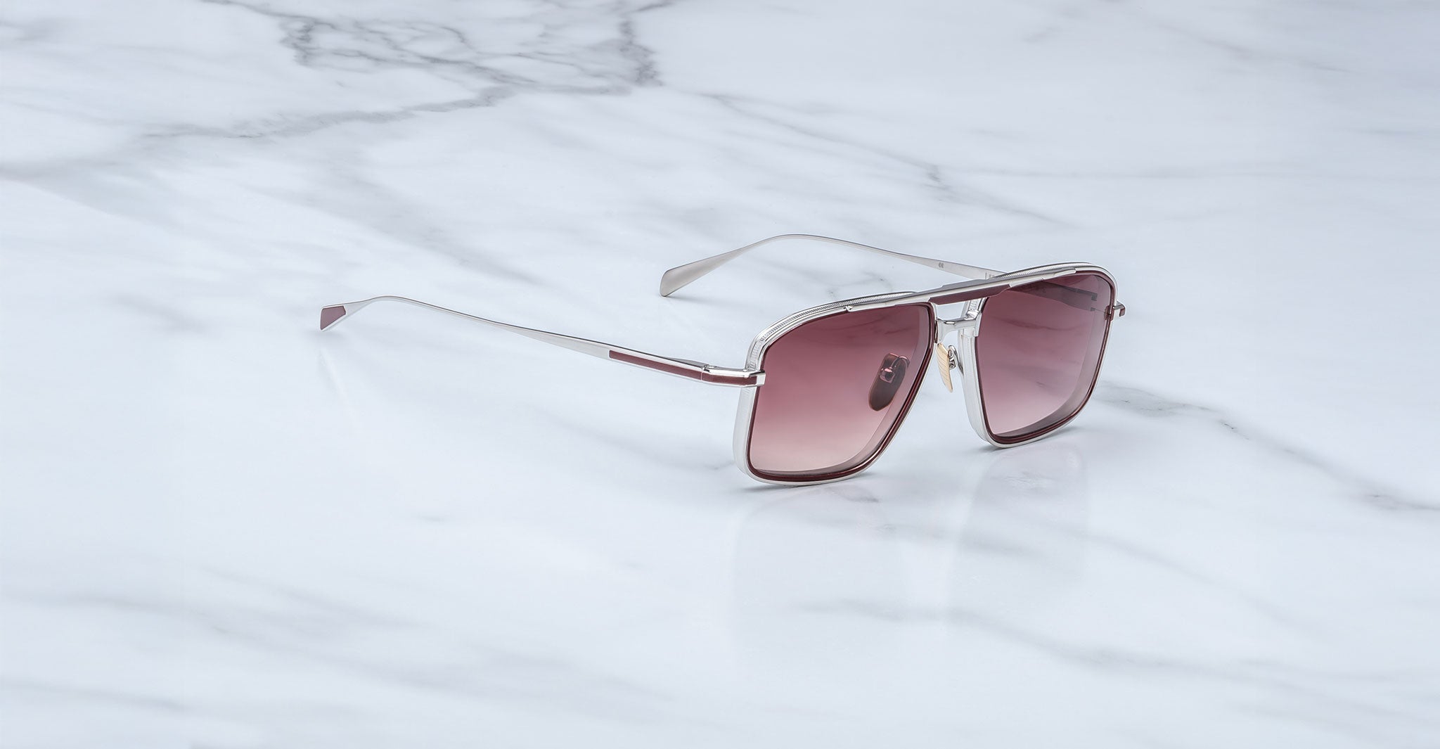 Jacques Marie Mage Earl sunglasses with silver frames and pink gradient lenses, shown from the front.