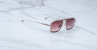 Jacques Marie Mage Earl sunglasses with silver frames and pink gradient lenses, shown from the front.
