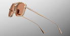 Jacques Marie Mage Earl sunglasses with gold frames and brown rectangular lenses, front angle view.