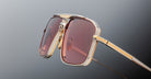 Jacques Marie Mage Earl gold sunglasses, close-up view, featuring rectangular pink lenses.