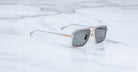 Jacques Marie Mage Earl aviator sunglasses with silver frames and dark lenses, top view.