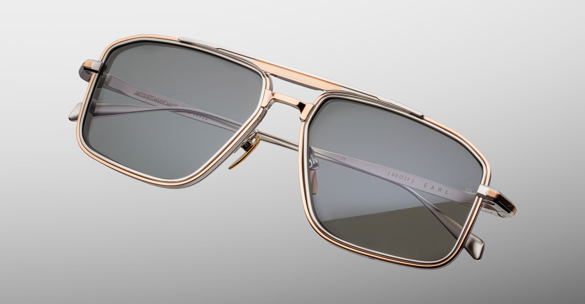 Jacques Marie Mage Earl gold rectangular sunglasses with dark lenses, front view.