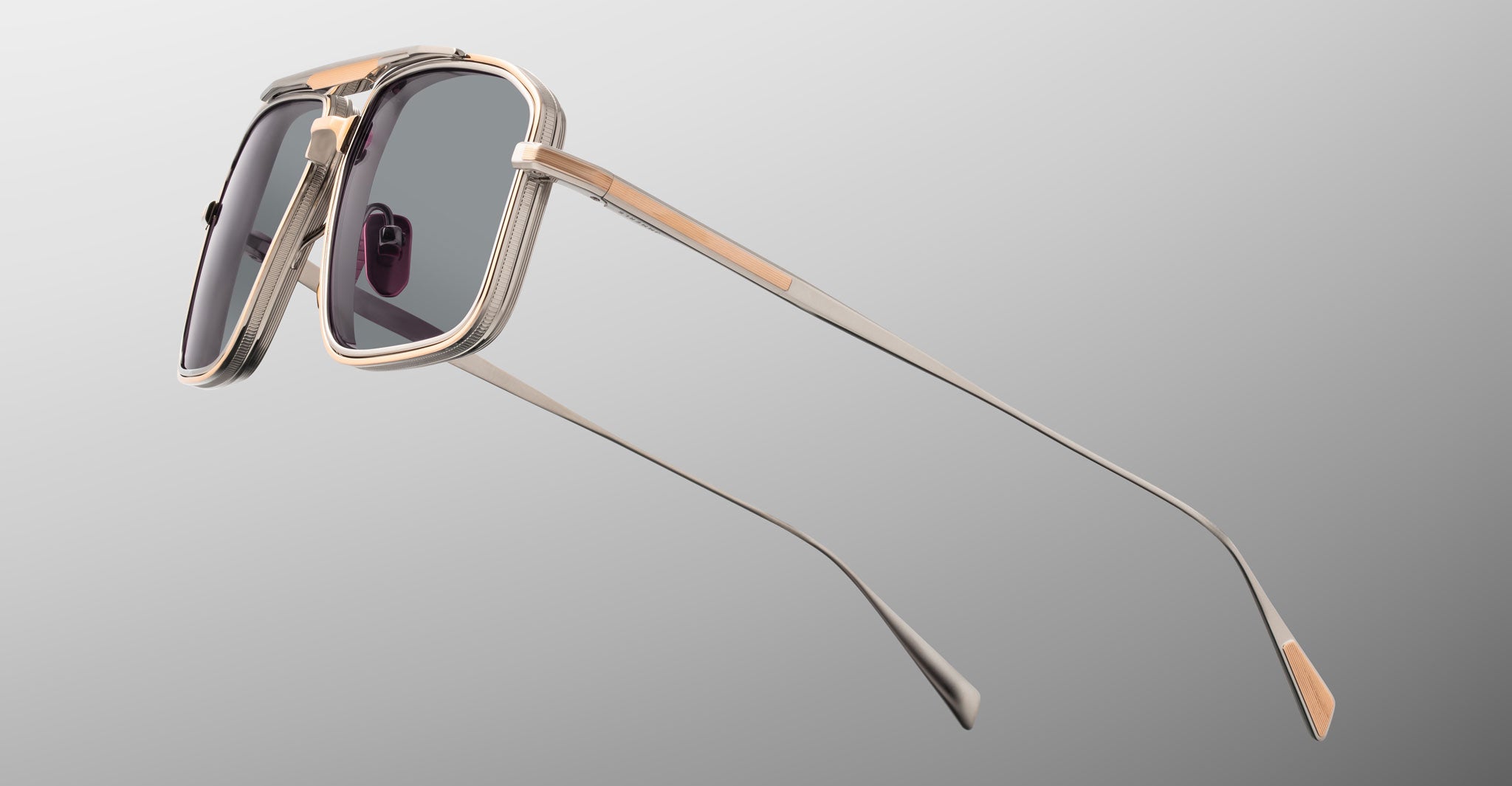 Jacques Marie Mage Earl sunglasses with metallic frames and dark lenses, shown from the front.