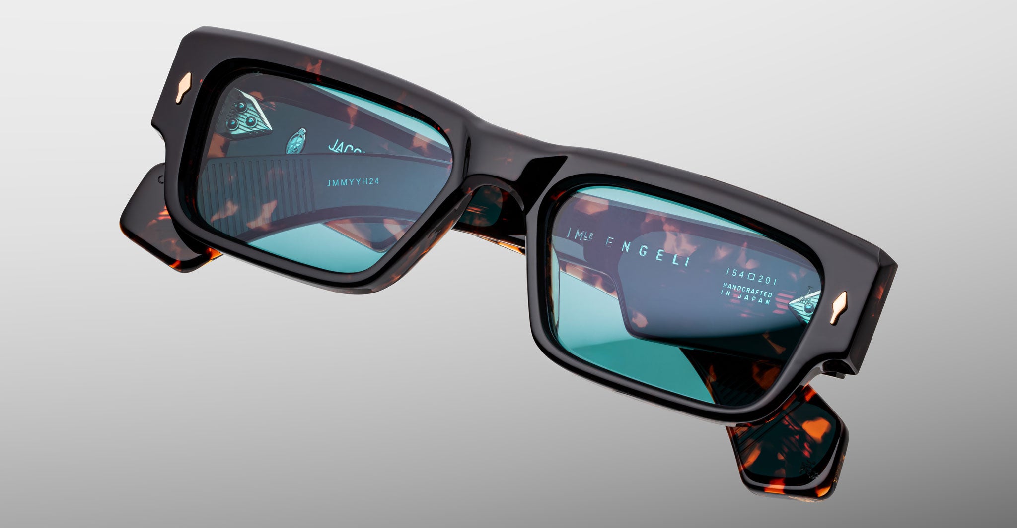 Jacques Marie Mage Engel rectangular tortoiseshell sunglasses with thick frames and teal lenses, front angle.
