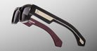 Two Jacques Marie Mage Engel sunglasses with thick frames and metal accents, shown from above.