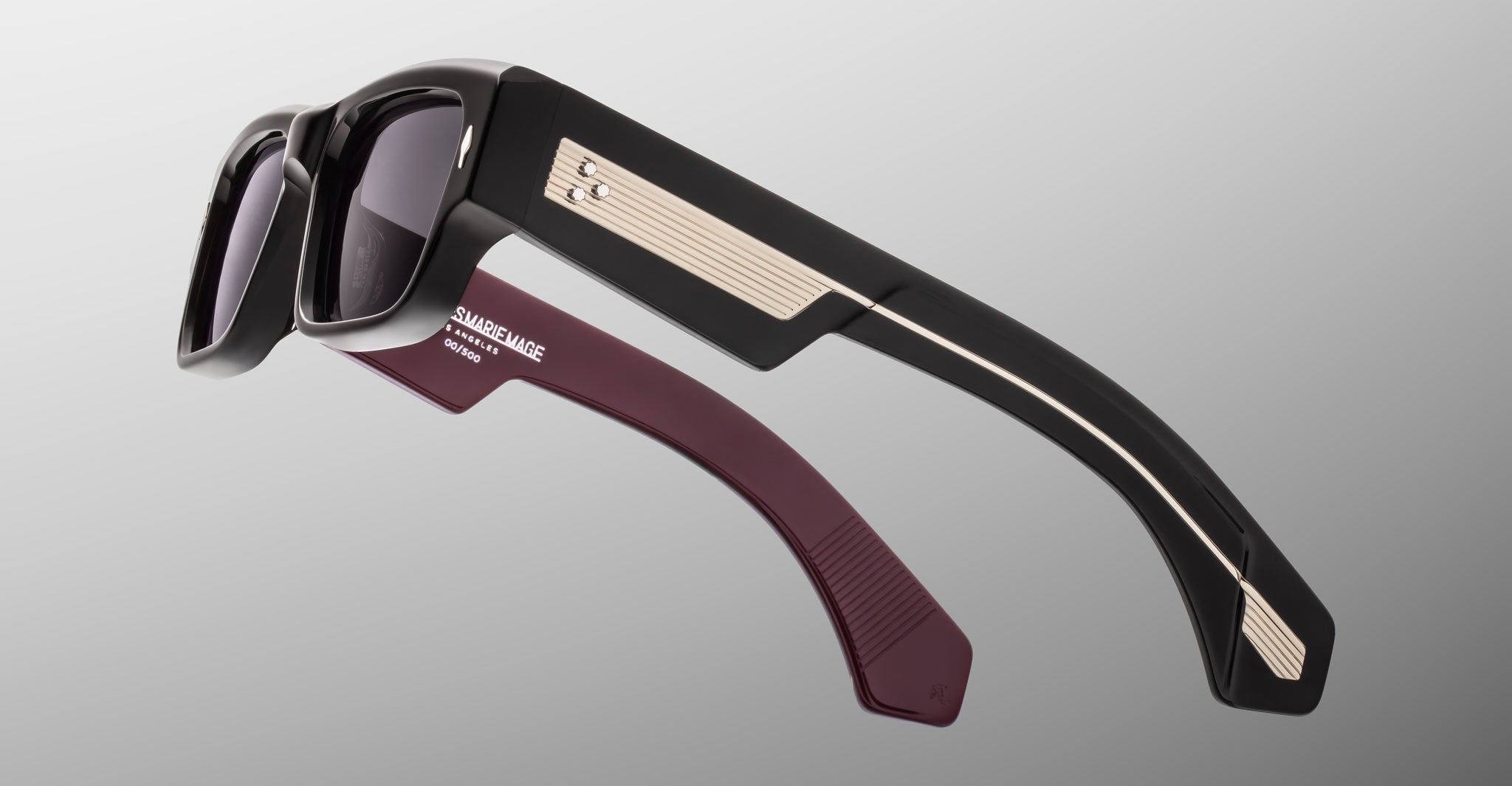 Two Jacques Marie Mage Engel sunglasses with thick frames and metal accents, shown from above.