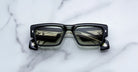 Jacques Marie Mage Engel rectangular black sunglasses, front angle, reflect windows and blinds.