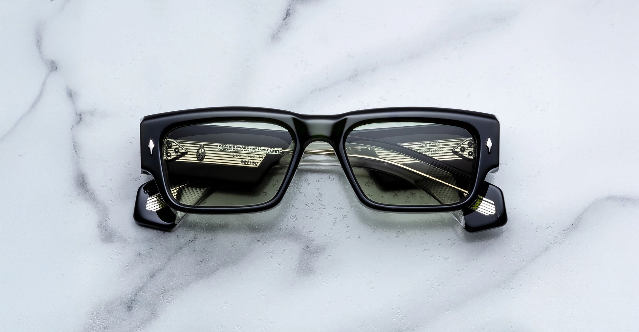 Jacques Marie Mage Engel rectangular black sunglasses, front angle, reflect windows and blinds.
