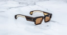 Jacques Marie Mage Engel thick brown rectangular polarized sunglasses, top view.