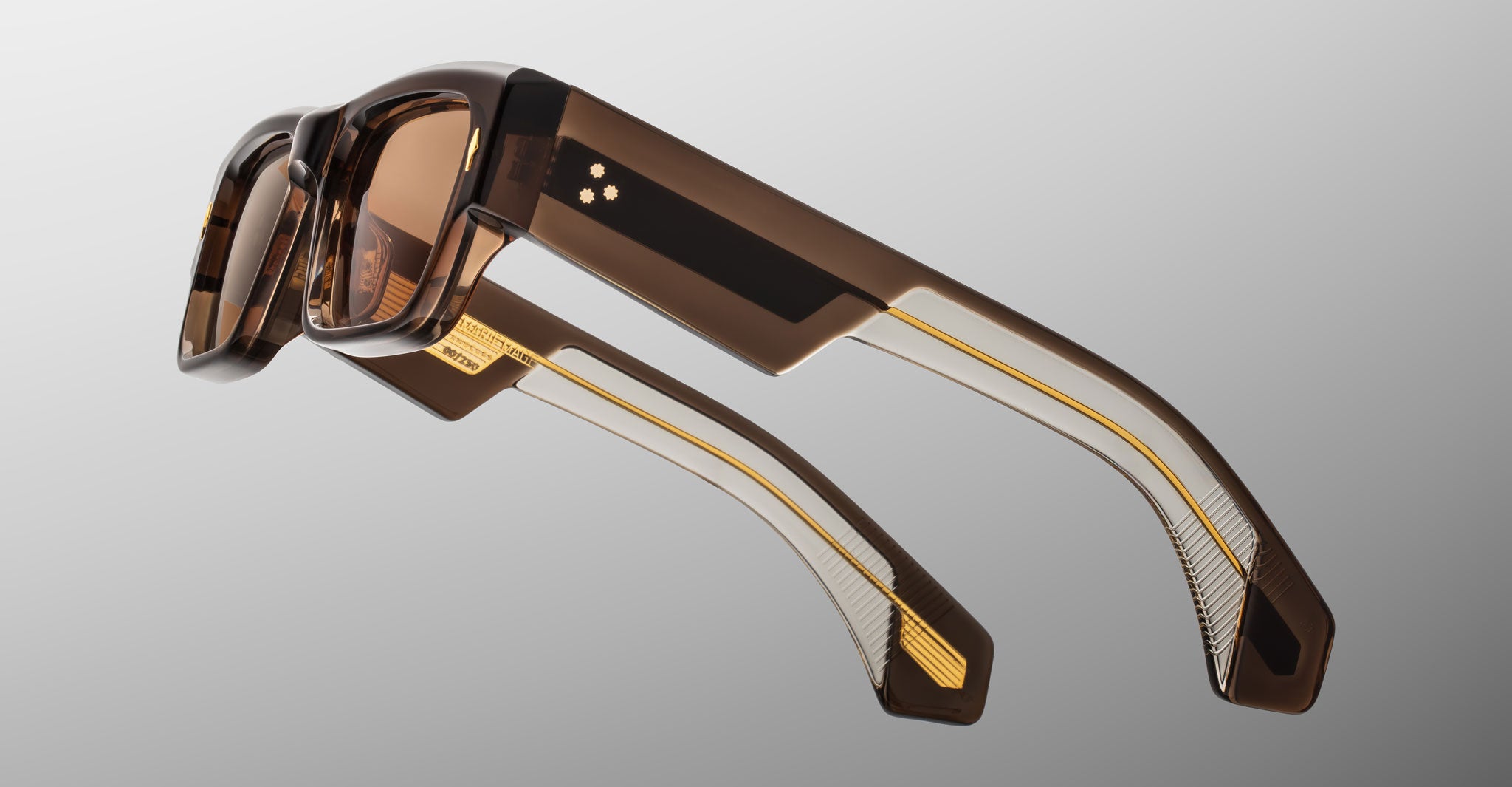 Jacques Marie Mage Engel eyeglasses, brown translucent thick frames with gold details, shown from the front angle.