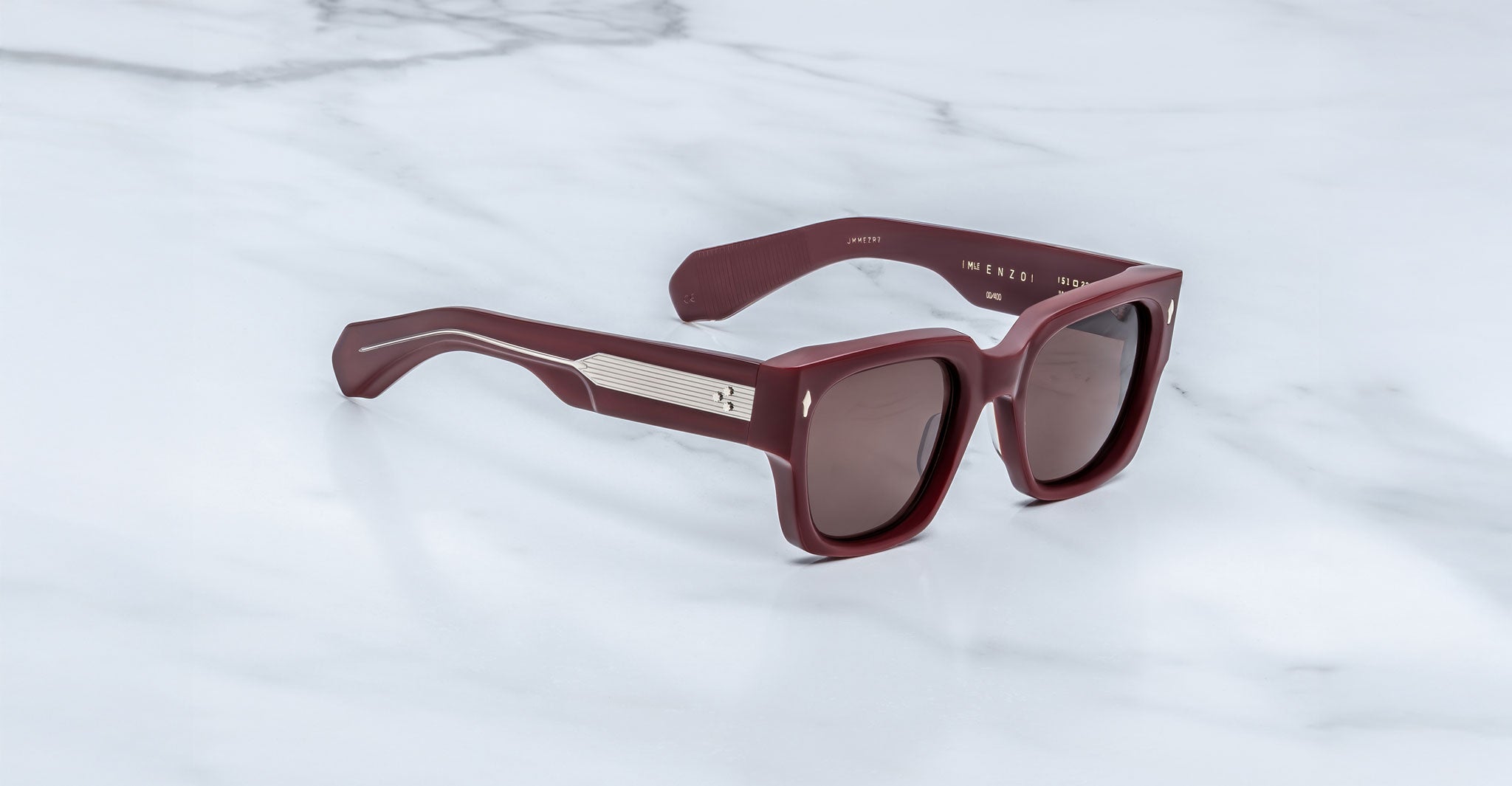 Jacques Marie Mage Enzo sunglasses, burgundy rectangular frames with chunky design and metallic temples, front view.
