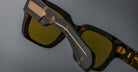 Close-up of Jacques Marie Mage Enzo tortoiseshell sunglasses, polarized lenses, gold temple accents, front angle view.