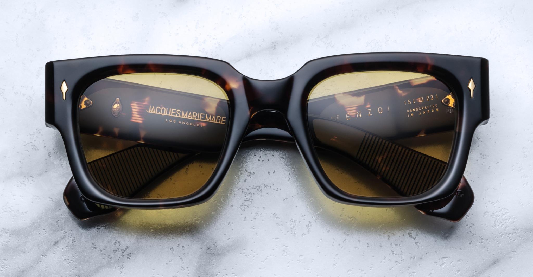 Jacques Marie Mage Enzo rectangular sunglasses with gold accents, top view, showcasing frame and temples.