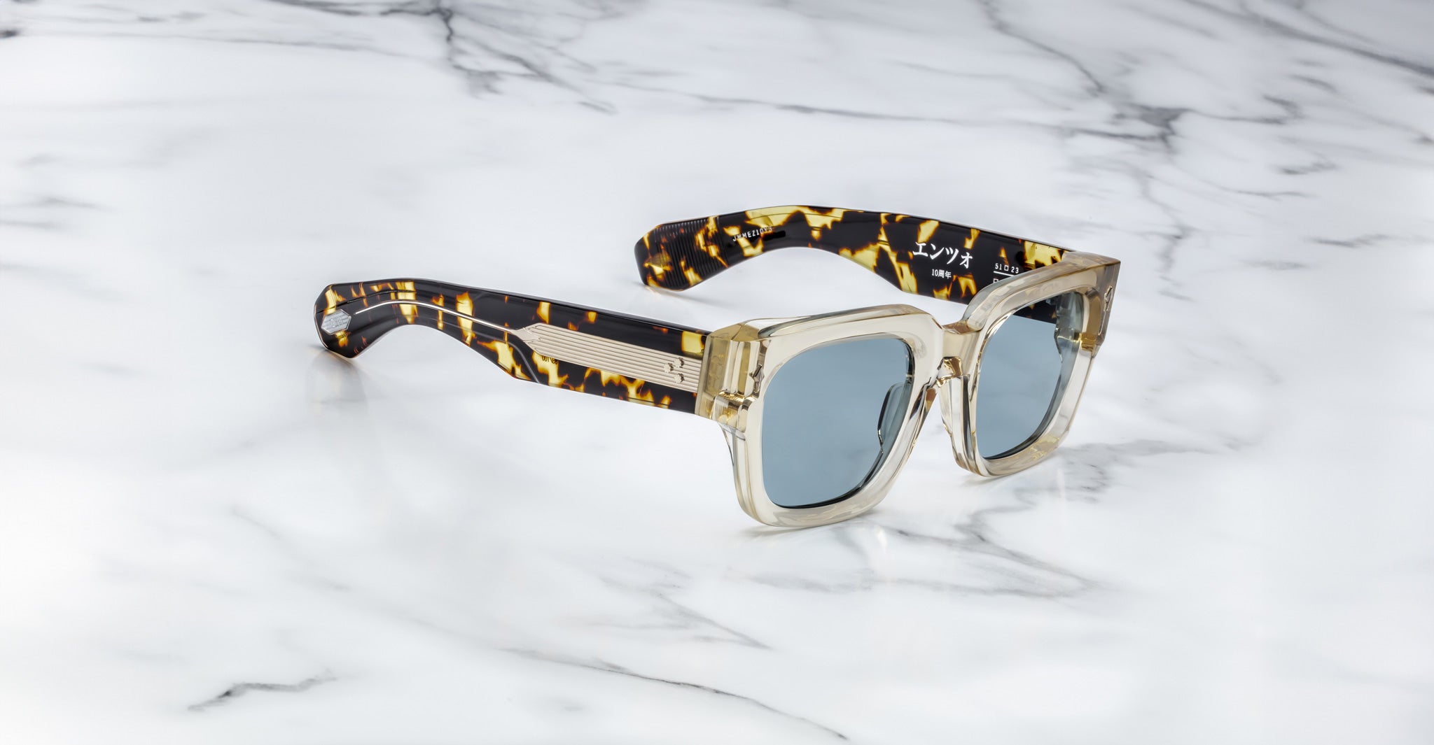 Jacques Marie Mage Enzo square sunglasses in tortoiseshell and clear acetate with blue polarized lenses, front angle view.