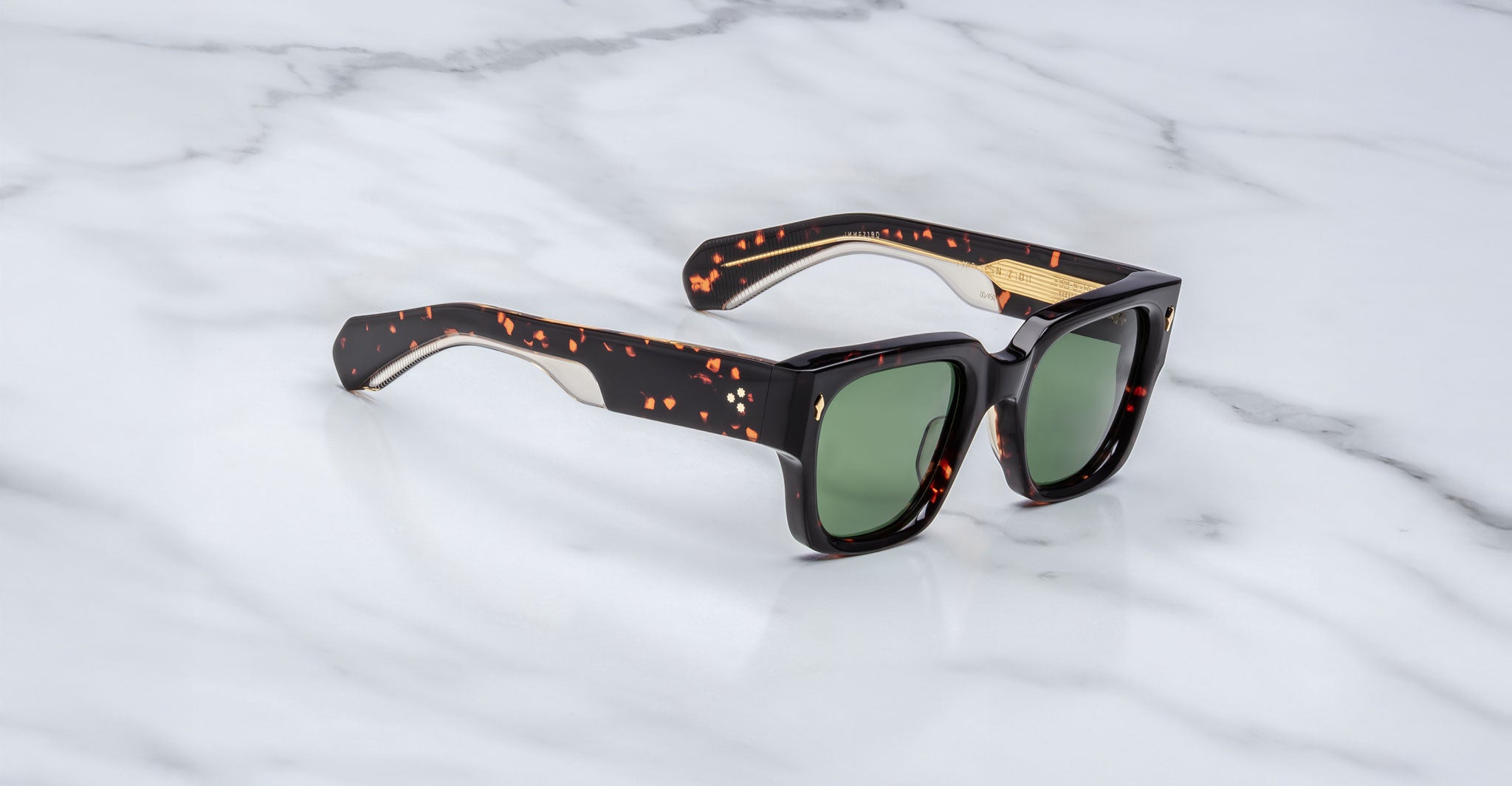 Jacques Marie Mage Enzo sunglasses with green lenses, viewed from above, display the frame and lens color clearly.