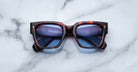 Jacques Marie Mage Enzo rectangular tortoiseshell sunglasses with blue lenses, front view.