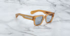 Jacques Marie Mage Enzo brown square sunglasses with UV-protection lenses, top view.