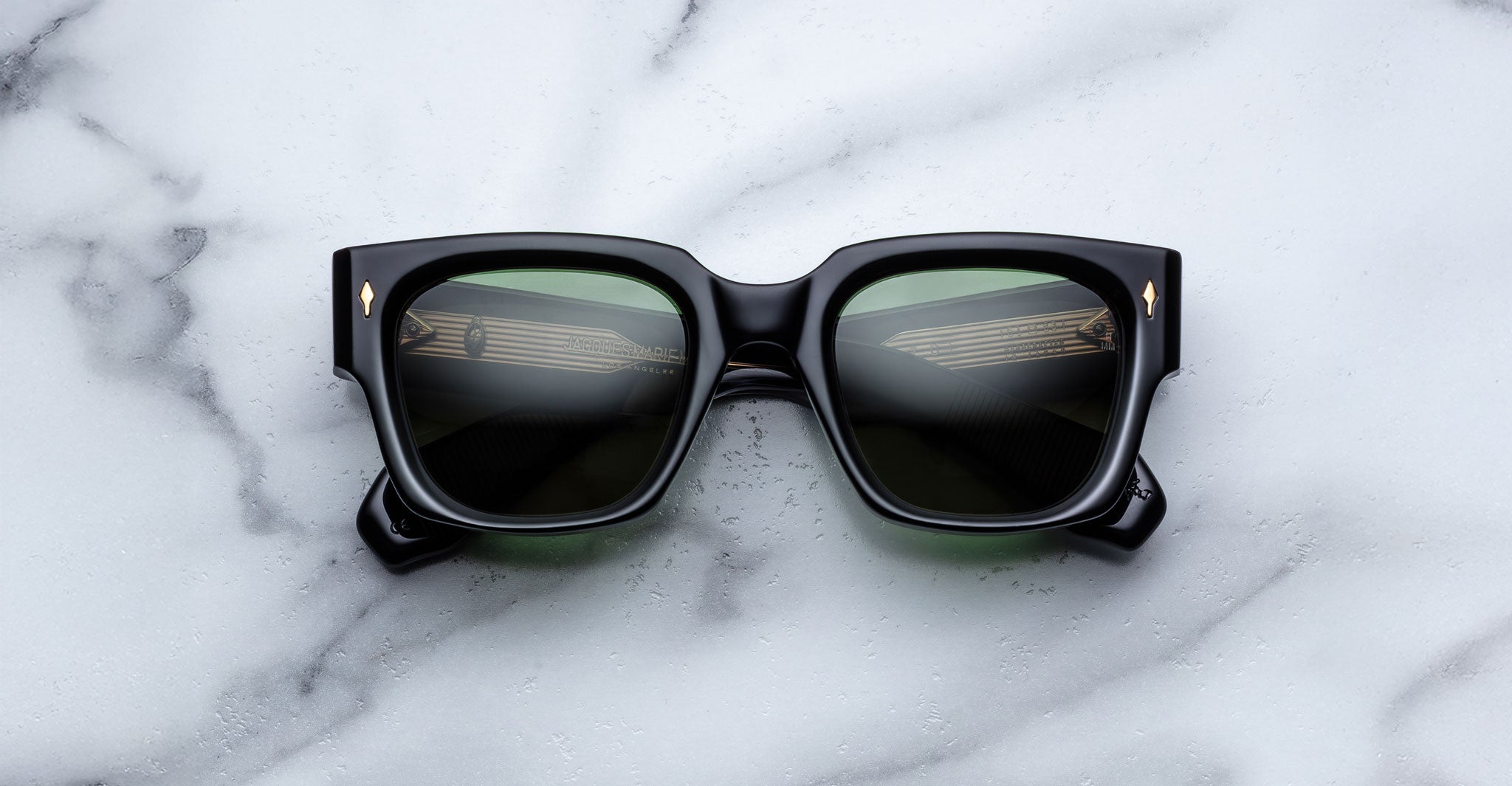 Jacques Marie Mage Enzo sunglasses with UV protection shown from above, highlighting the frame and lenses.
