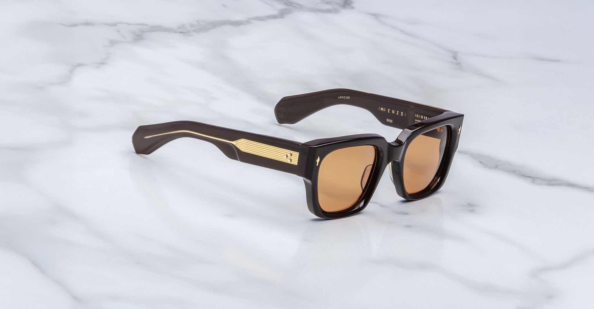 Jacques Marie Mage Enzo black square sunglasses with gold accents, front view.