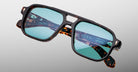 Jacques Marie Mage Evans tortoiseshell sunglasses with blue lenses, front view showing classic rectangular frame.