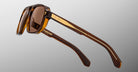 Jacques Marie Mage Evans sunglasses, angular brown frames with gold accents and tinted lenses, front view.