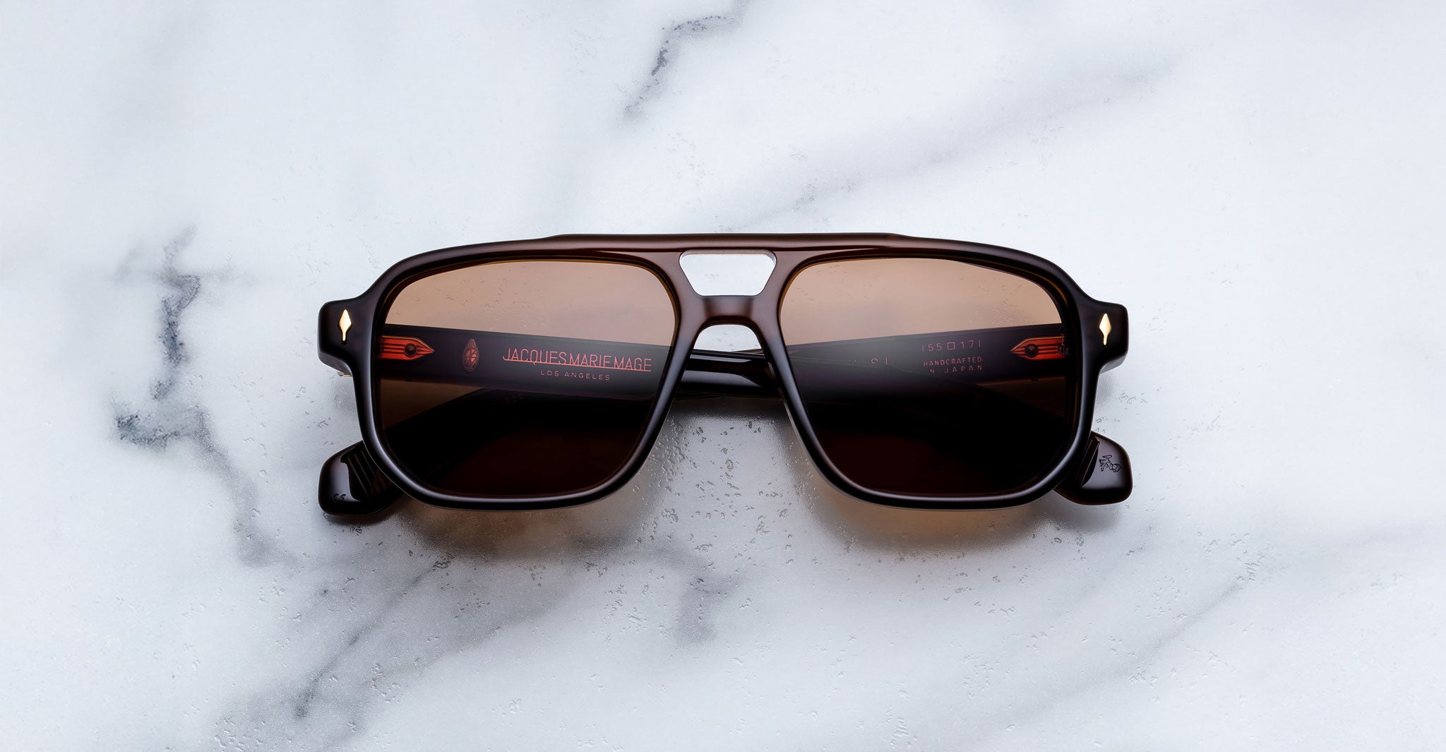 Jacques Marie Mage Evans black rectangular sunglasses with UV-protective lenses, shown from above.