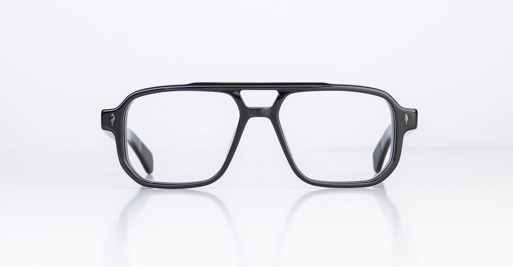 The Jacques Marie Mage Evans are black rectangular optical glasses with a keyhole bridge and oversized acetate frame, showcased on a white background.