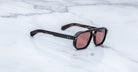 Jacques Marie Mage Evans sunglasses with brown tinted lenses, shown from above.