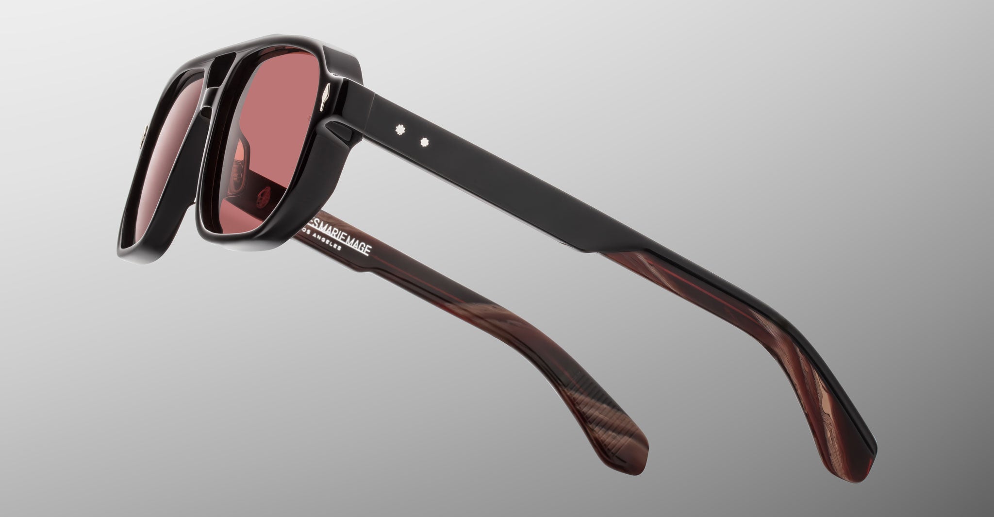 Jacques Marie Mage Evans sunglasses with black frames, red lenses, marbled brown arms, and red accents, front view.