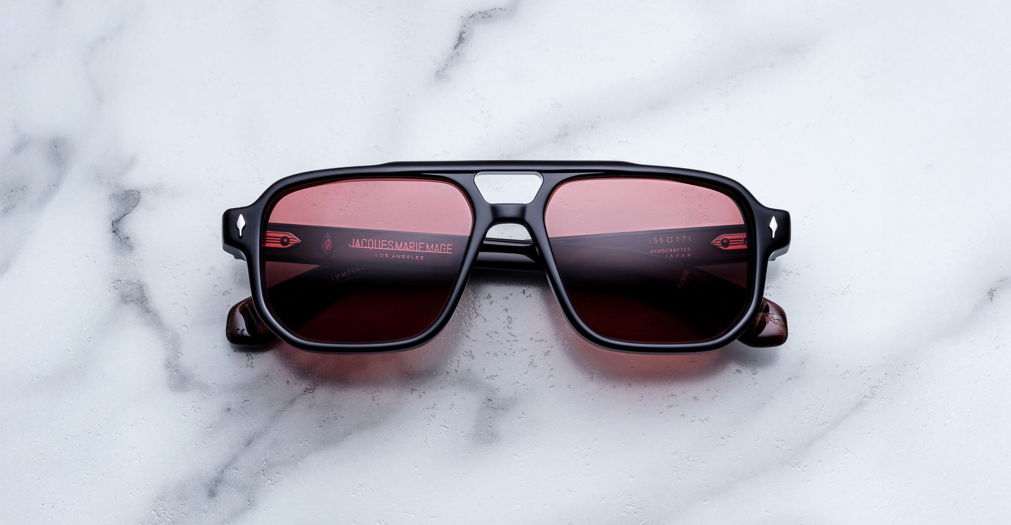 Jacques Marie Mage Evans sunglasses with red lenses, front view, showing round frames and wide temples.