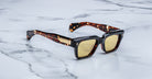 Jacques Marie Mage Fellini tortoiseshell sunglasses with yellow lenses, top view.