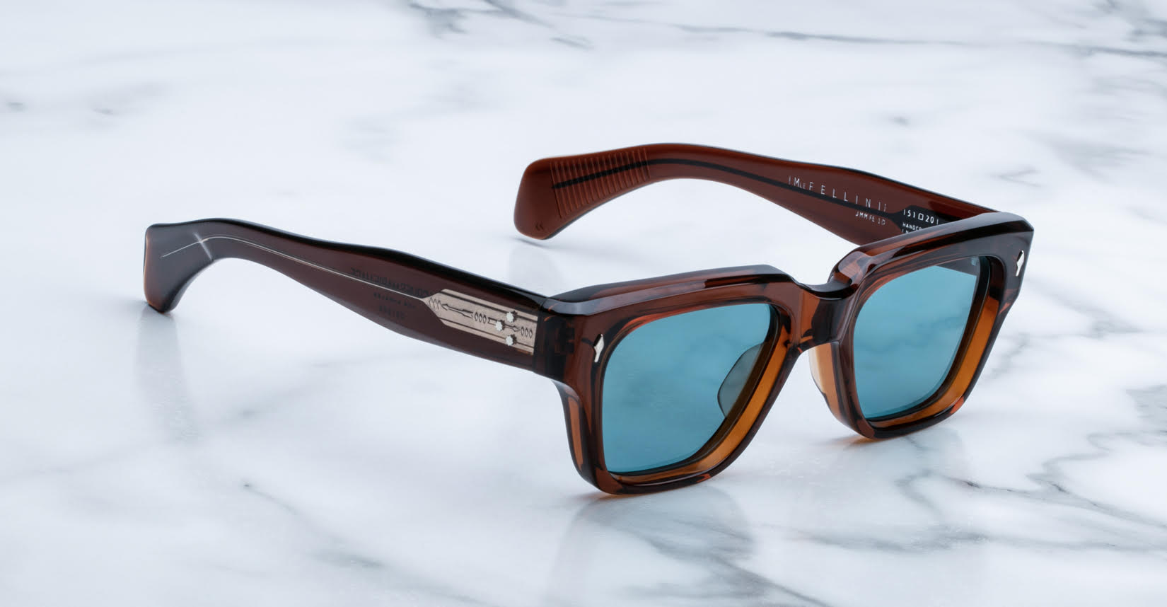 Jacques Marie Mage Fellini sunglasses with blue lenses, top view, showing full frame design.