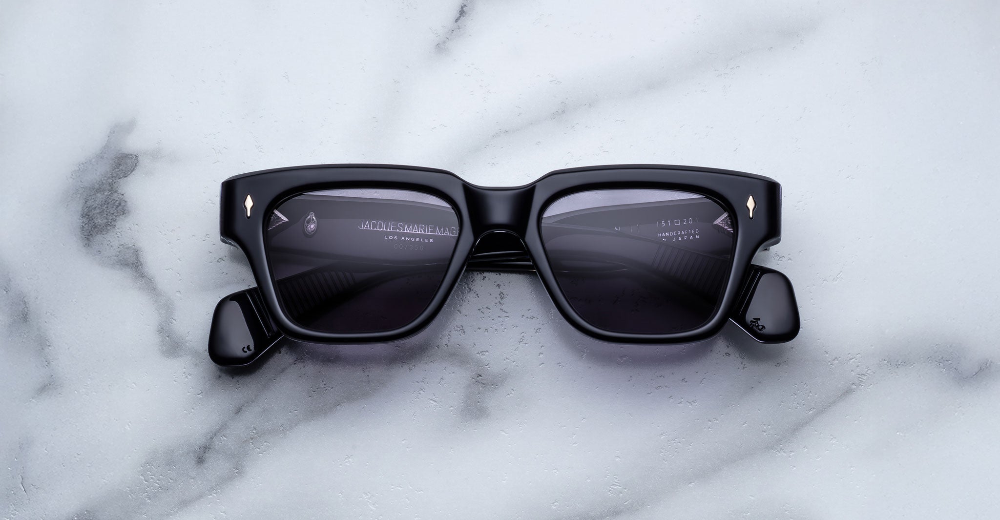 Jacques Marie Mage Fellini rectangular sunglasses with UV lenses, top view.