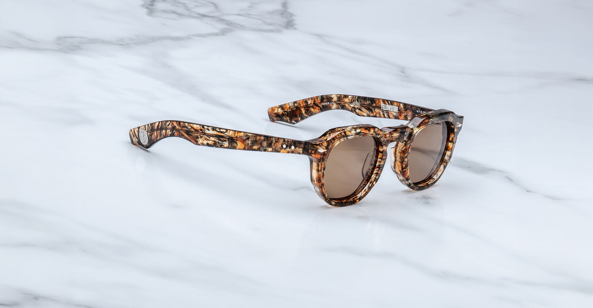 Jacques Marie Mage Firehole River round sunglasses shown from above, displaying frame shape and details.