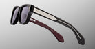 Jacques Marie Mage Fly sunglasses with thick black frames, metallic arms, and maroon temples, front view.
