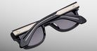 Jacques Marie Mage Fly sunglasses, folded with gold accents, top view showing frame details.