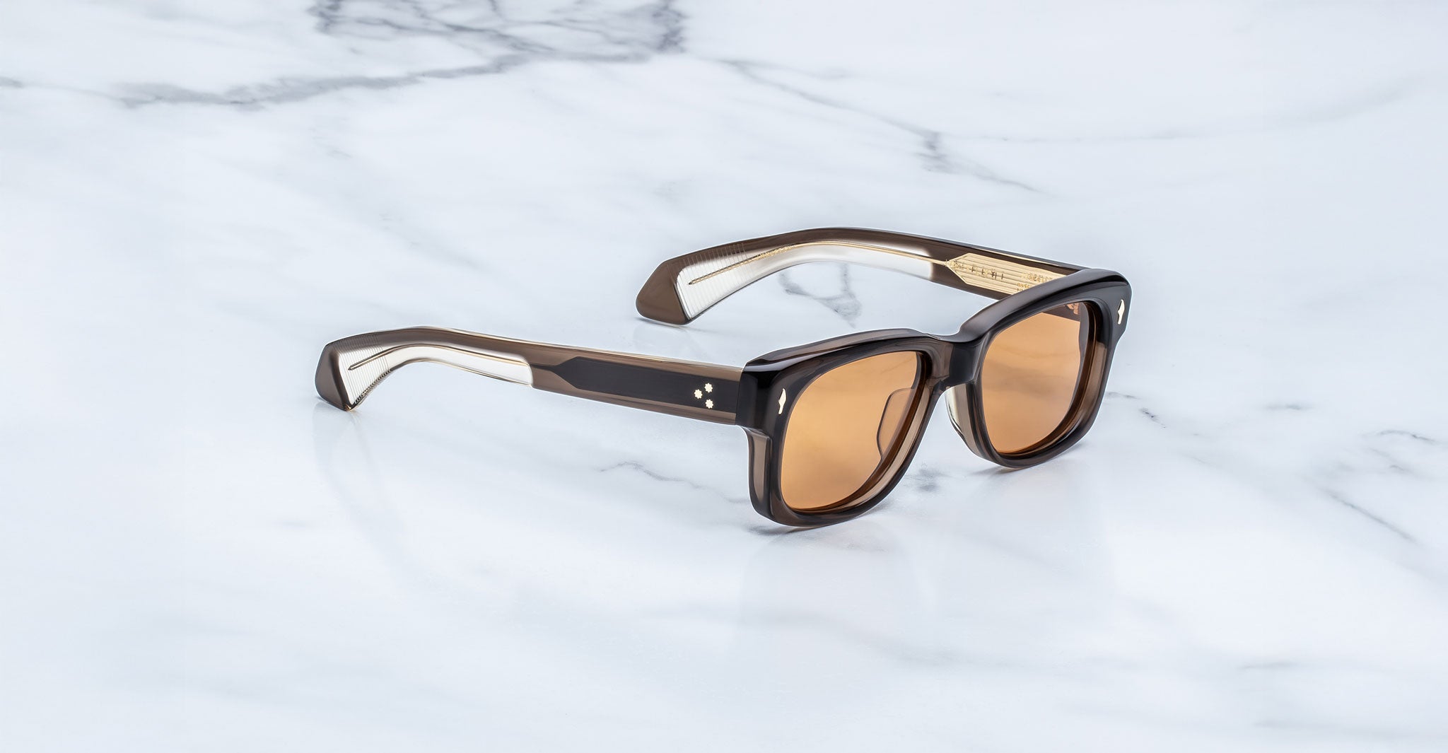 Jacques Marie Mage Fly sunglasses, black-beige frames, brown lenses, top view.