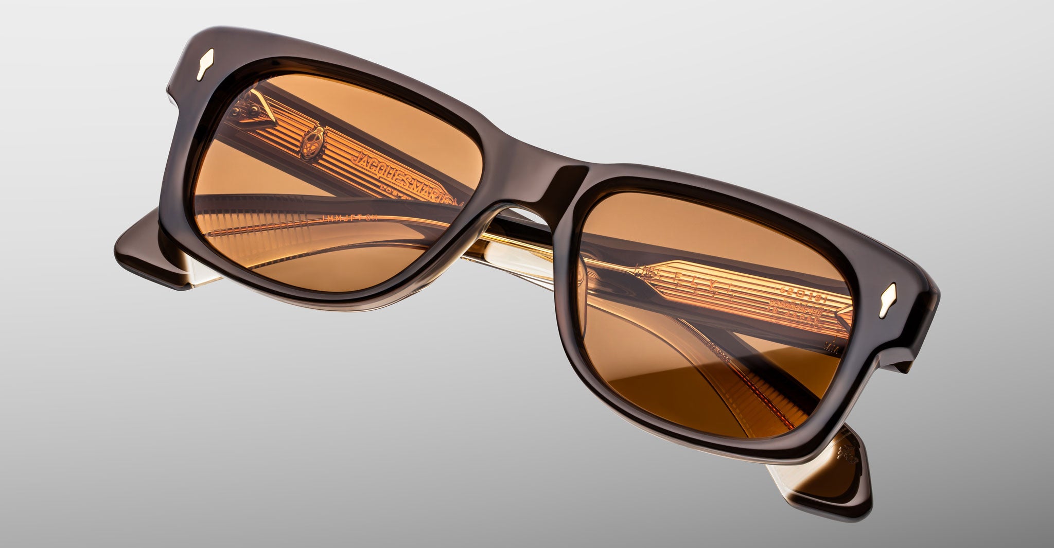 Jacques Marie Mage Fly sunglasses, brown rectangular frame with amber polarized lenses, front view.