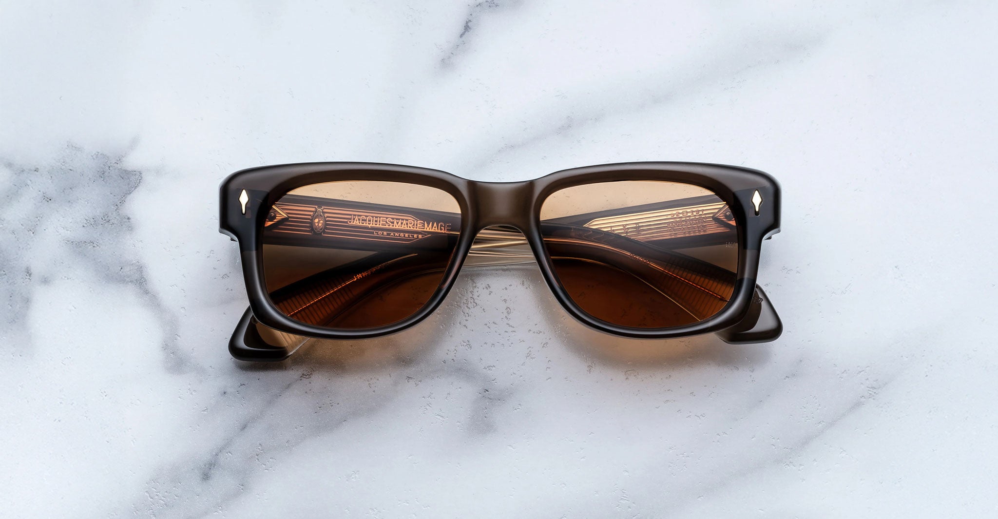 Jacques Marie Mage Fly rectangular brown sunglasses with polarized dark lenses, top view.