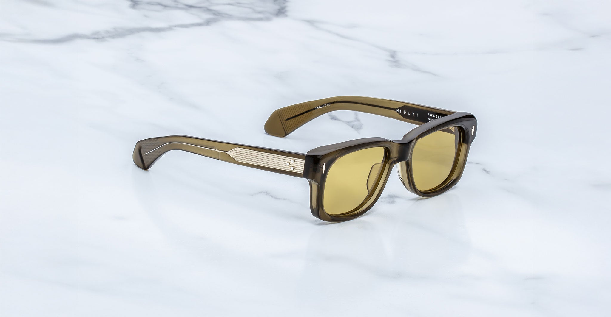 Jacques Marie Mage Fly sunglasses, brown rectangular frames, thick design, viewed from above.