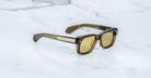 Jacques Marie Mage Fly sunglasses, brown rectangular frames, thick design, viewed from above.