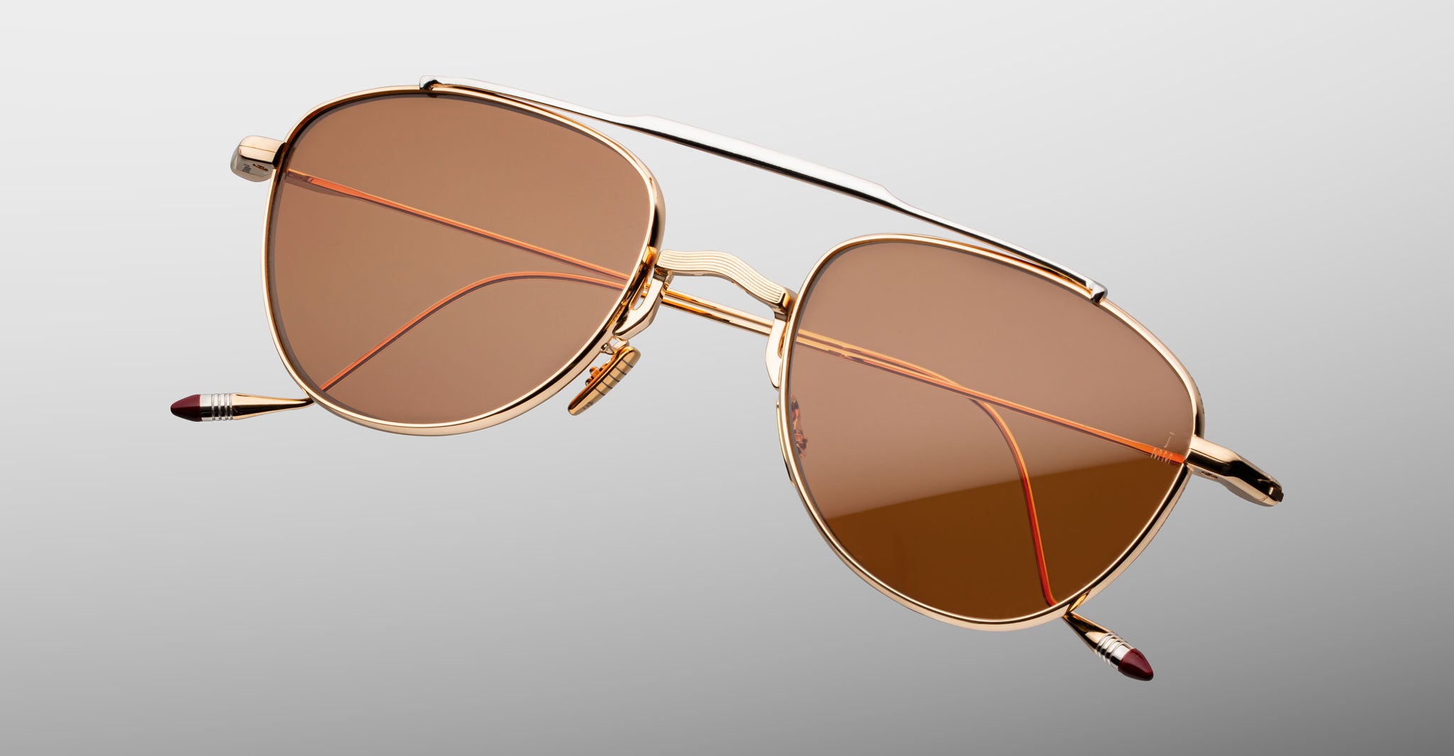 Jacques Marie Mage Flynn gold aviator sunglasses with brown lenses, front angle view.