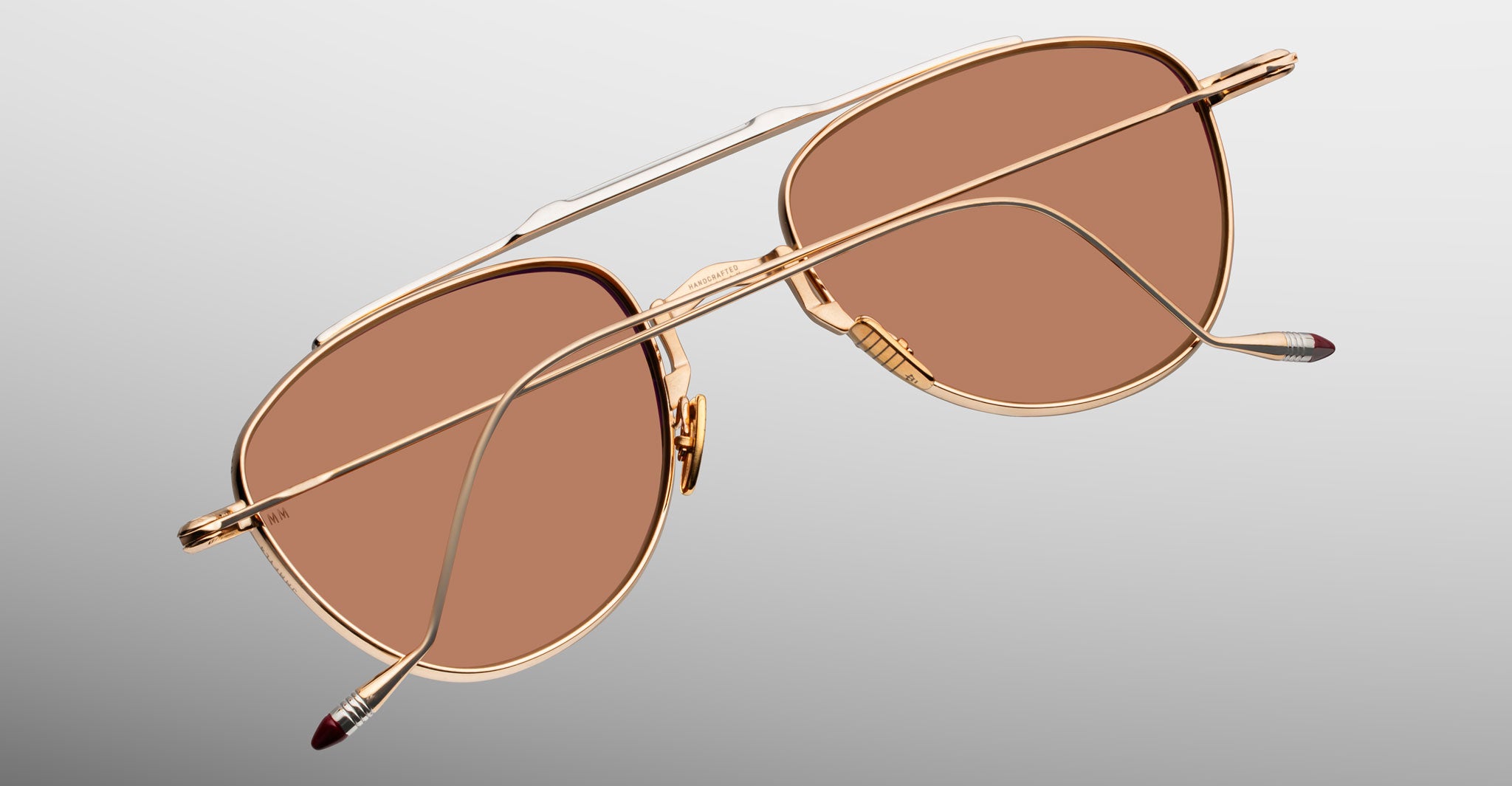 Jacques Marie Mage Flynn gold aviator sunglasses with brown lenses, rear view.