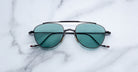 Jacques Marie Mage Flynn aviator sunglasses shown from above, displaying frame details and lens shape.